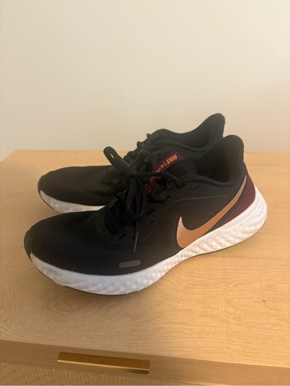 Nike Women's Black Running Shoes with Copper Swoosh and White Midsole